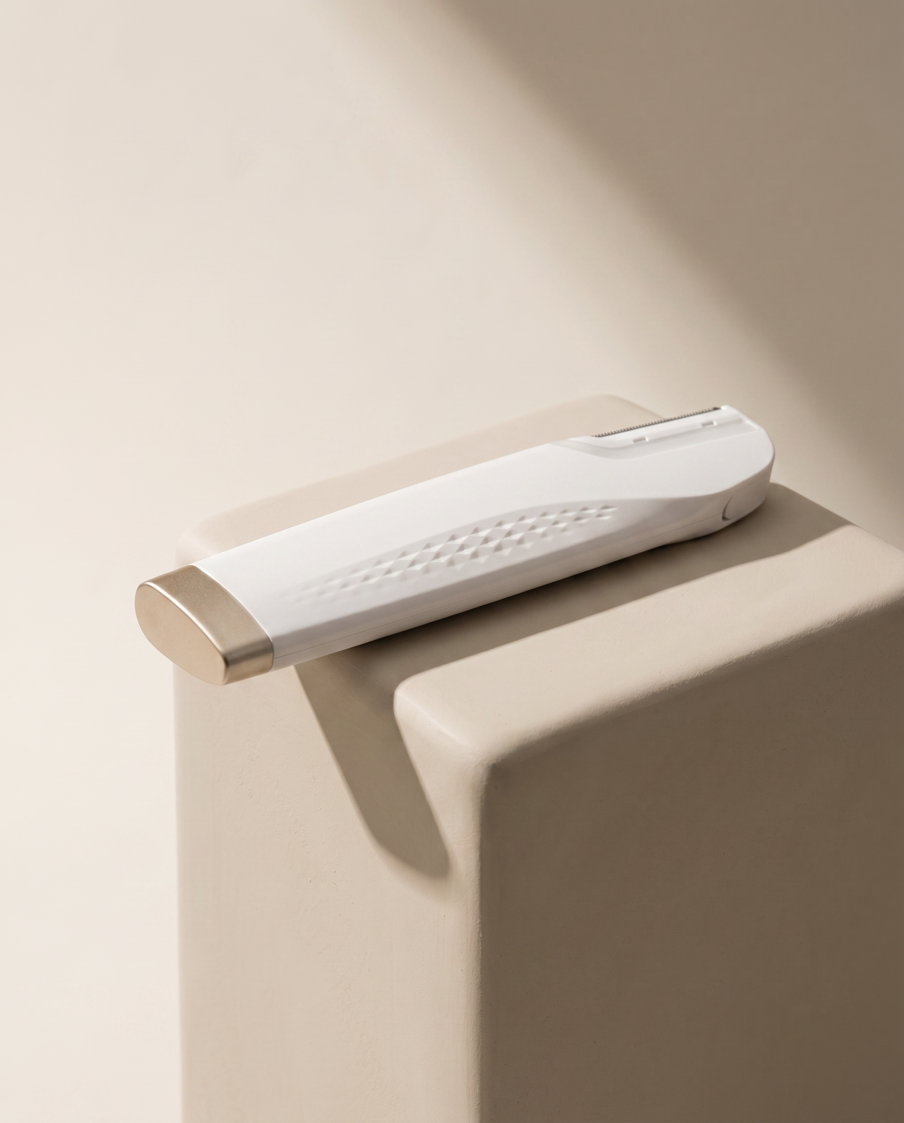 GlowPrep sonic dermaplaning device with premium white and champagne-gold design